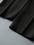 Pantalón recto relax negro con dobladillo y caída recta
