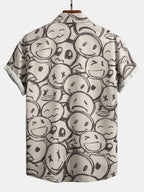 Camisa de manga corta color arena con estampado de caritas en la espalda, cuello y botones