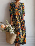 Vestido largo bohemio multicolor con estampado floral oscuro y escote en V, mangas largas